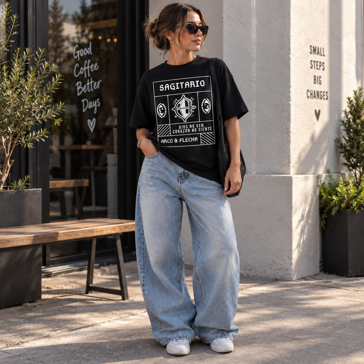 Remera Oversize Sagitario negra en outfit urbano con jean ancho